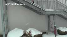 020167 Kathy Pees From A Staircase In The Snow