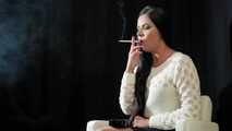 Watch lovely Tanya lighting up and smoking a 120mm Cigaronne