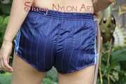 Watching Aiyana wearing only a sexy blue shiny nylon shorts watering the garden (Pics)