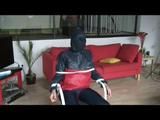03:20 Min. video with Katharina tied and gagged in a shiny nylon rainsuit