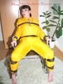 Jill tied, gagged and hooded with a tension belt on a chair wearing a supersexy yellow shiny nylon rainpants and rain jacket (Pics)