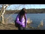 Alina walking in a lake wearing a supersexy purple down jacket and a jeans (Video)