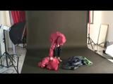 Blackhaired archive girl posing in sexy shiny nylon rainwear (Video)