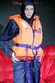 DESTINY wearing a sexy rain suit and putting on a life jacket (Pics)