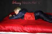 Watching Sonja wearing a black shiny nylon rain pants and a shiny nylon rain jacket preparing bed (Pics)