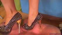 Katrin, her extreme-heels and the perforated carpet-slave