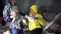 Watching sexy Stella and Sandra having fun with shaving cream and eachother both wearing shiny nylon rainwear (Video)