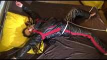 Get a Video with Lucy bound and gagged in a shiny nylon oldschool Skisuit from our Archives