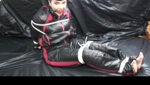 04:00 Min. video with Jill tied and gagged in a shiny nylon skisuit