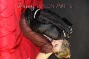 NEW MODELL MIA being tied and gagged with ropes and a clothgag wearing a sexy brown shiny nylon pants and a black rain jacket (Pics)
