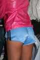 Watching a sexy archive girl wearing a hot lightblue shiny nylon shorts and a pink shiny nylon rainjacket doing her household (Pics)