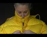 Sexy Mara trying on her new yellow down jacket and her lifevest in combination with a sexy shiny black rain pants and rubber boots (Video)