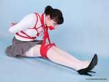 Rozanka - Leggy brunette rocks a schoolgirl uniform during her bondage shoot