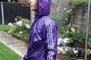 Watching sexy Aiyana wearing a sexy purple shiny nylon shorts and a purple shiny nylon rain jacket enjoying the garden shower (Pics)