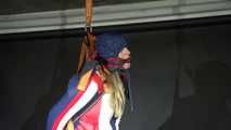 Watching sexy Sandra wearing a sexy oldschool downbib and a down jacket being suspended, tied, gagged and hooded with ropes and a ballgag (Video)