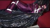 Lucy tied, gagged and hooded on the sofa wearing a sexy purple shiny nylon downwear combination (Video)