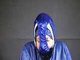 Watch Sandra beeing bound, pantygagged and finally pantyhooded in her shiny nylon Rainwear