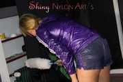 Watching sexy Pia wearing a sexy blue/purple shiny nylon shorts and a purple rain jacket dusting the studio (Pics)