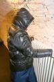 Jill tied and gagged on a heater wearing a shiny black down jacket and a darkblue rain pants (Pics)