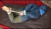 Jill tied, gagged and hooded on a princess bed in an old cellar wearing a shiny grey nylon pants and a shiny blue rain jacket (Video)