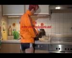 Sonja cleaning up the kitchen wearing a sexy black shiny nylon shorts and an orange rain jacket (Video)