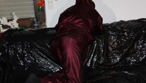 Watching Lucy wearing a supersexy purple/red downsuit preparing her sofa and lolling on it (Pics)