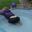 Watching sexy Sonja wearing a sexy shiny nylon rain pant and a purple down jacket enjoying the water in the swimming pool (Video)