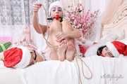 [From archive] Lucky, Nelly, Xenia - Santa’s little helpers hogtied and wrapped up on a bed 1