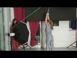 Alina and Jenny testing bondage both wearing sexy shiny nylon rainwear jumpsuits (Video)