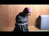 03:30 Min. video with Katharina tied and gagged in two layers of shiny nylon rainwear
