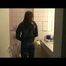 Alina lolling in a bed wearing supersexy blue rainwear (Video)