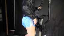 Watching sexy SONJA wearing a sexy blue shiny nylon shorts and a rainjacket during her workout on the hometrainer (Video)