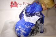 Watching Sonja taking a foam bath  wearing sexy blue shiny nylon rainwear (Pics)