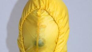 Jill tied and gagged on a chair wearing a yellow rainsuit and coveres with an yellow raincoat with two hoods (Pics)