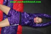 Sandra being tied and gagged overhead with ropes, a bar and a ballgag wearing sexy purple shiny nylon shorts and rain jacket (Pics) 