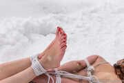 Naked barefoot Greta is tightly bound in snow - Photos