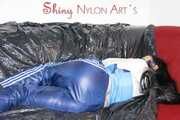 Lucy wearinmg a sexy blue rainwear combination lolling and feeling good in the clothes (Pics)