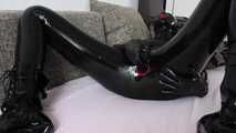 Rubber doll plays with herself