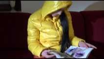 Watching sexy Lucy wearing a orange/yellow shiny nylon downwear combination reaing a magazine and lolling on the sofa (Video)