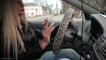 Ekaterina is smoking while driving her car