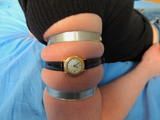 Tight metal hose clamps and a little wrist watch for Leas soft upper arms