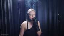 Blonde is smoking in a black leather gloves