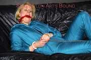 Pia wearing a supersexy oldschool downsuit in green ties and gagges herself with cuffs and a cloth gag (Pics)