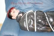 Jill tied and gagged wearing a sexy black down jacket and a sexy black rain pants (Pics)