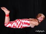 [From archive] Gatiita is mummified topless in red and white tape and hog taped