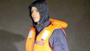 DESTINY wearing a sexy rain suit and putting on a life jacket (Pics)