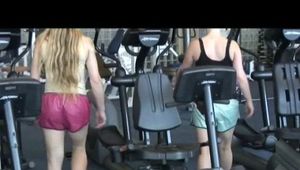 Katharina and Jenny in the fitness studio wearing sexy shiny nylon shorts and tops (Video)