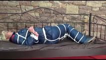 Pia tied and gagged on a princess bed wearing oldschool blue shiny downwear (Video)