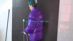 Get an Archive Video with Mara enjoying a shower with her shiny nylon downjacket