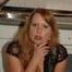 Chubby redhead  Benita stripping out of her black dress in the kitchen